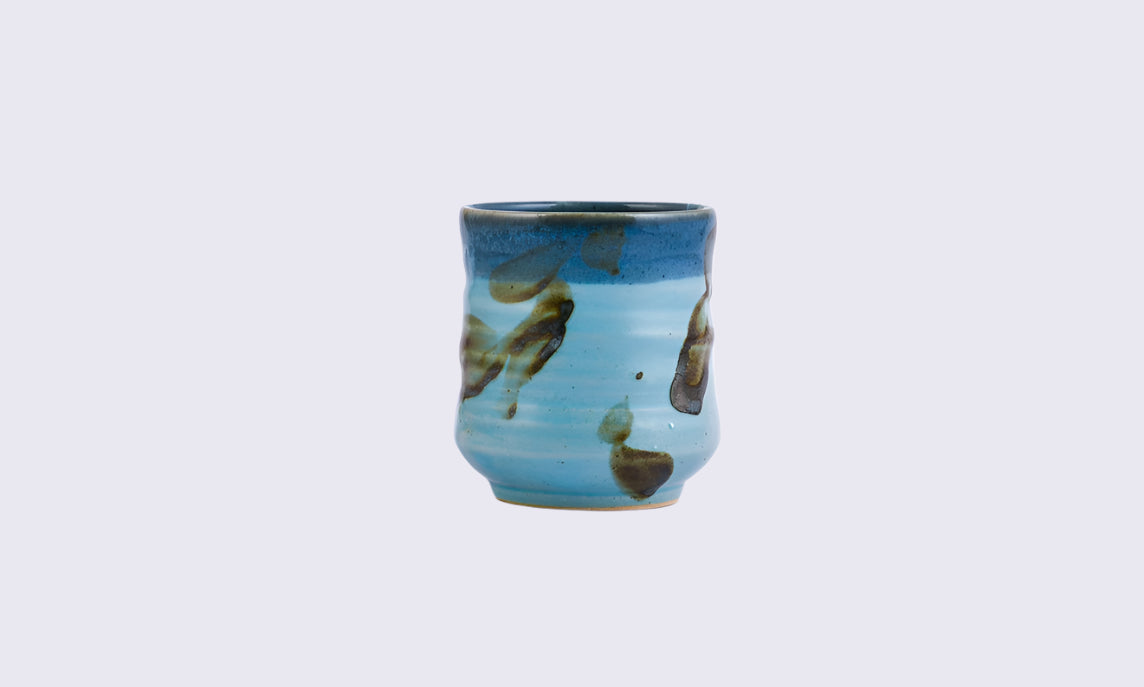 The irregular surface is a canvas of blue 
and earthy strokes of brown. SOKO is
not just a regular tableware, it's a 
functional art.SOKO is a multi-functional 
tableware, fit for drinking Tea, Coffee 
and Cold beverages too.