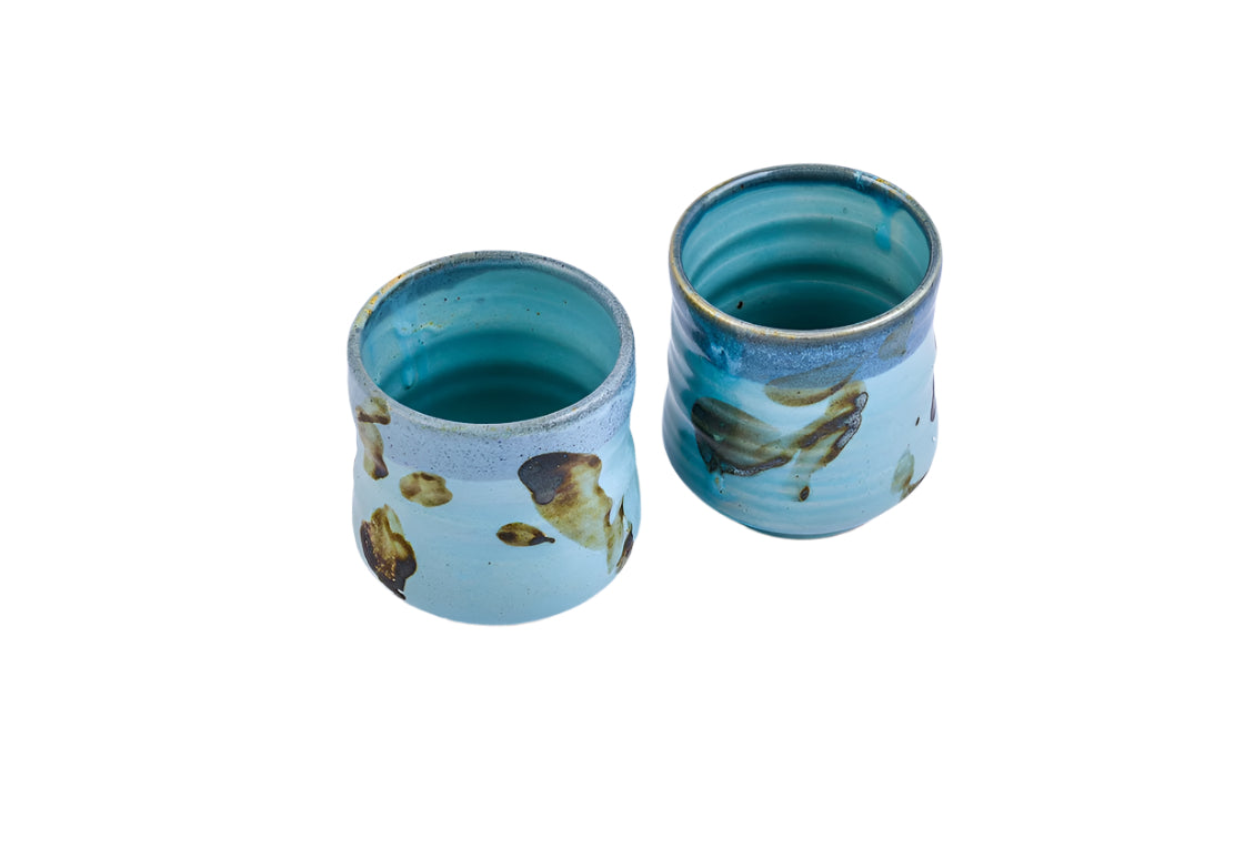 The irregular surface is a canvas of blue 
and earthy strokes of brown. SOKO is
not just a regular tableware, it's a 
functional art.SOKO is a multi-functional 
tableware, fit for drinking Tea, Coffee 
and Cold beverages too.